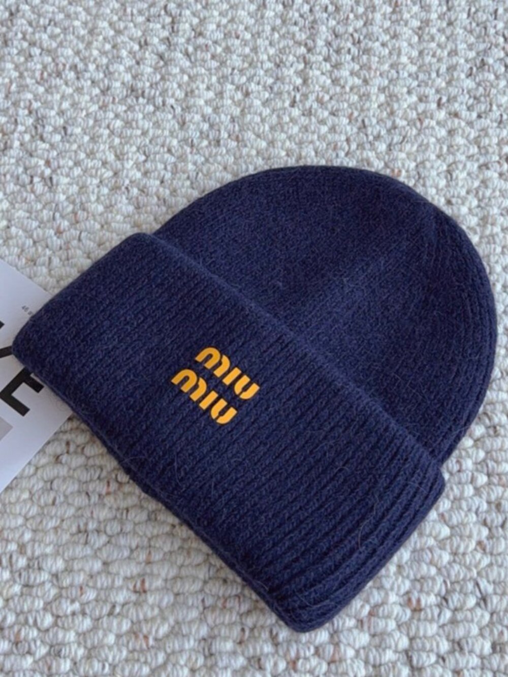 Miu Miu navy ribbed knit beanie with golden logo print